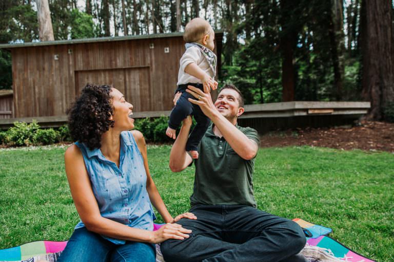 family playing together on a green lawn