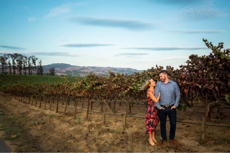 sunset in a vineyard, windblown couple